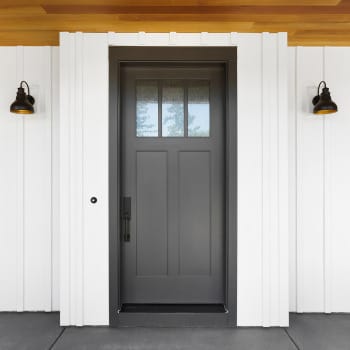 Stylish Dark Entry Door on a Farmhouse Style Home