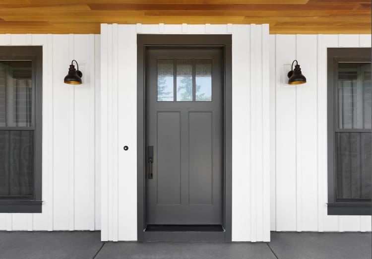 Stylish entry door on a farmhouse style home